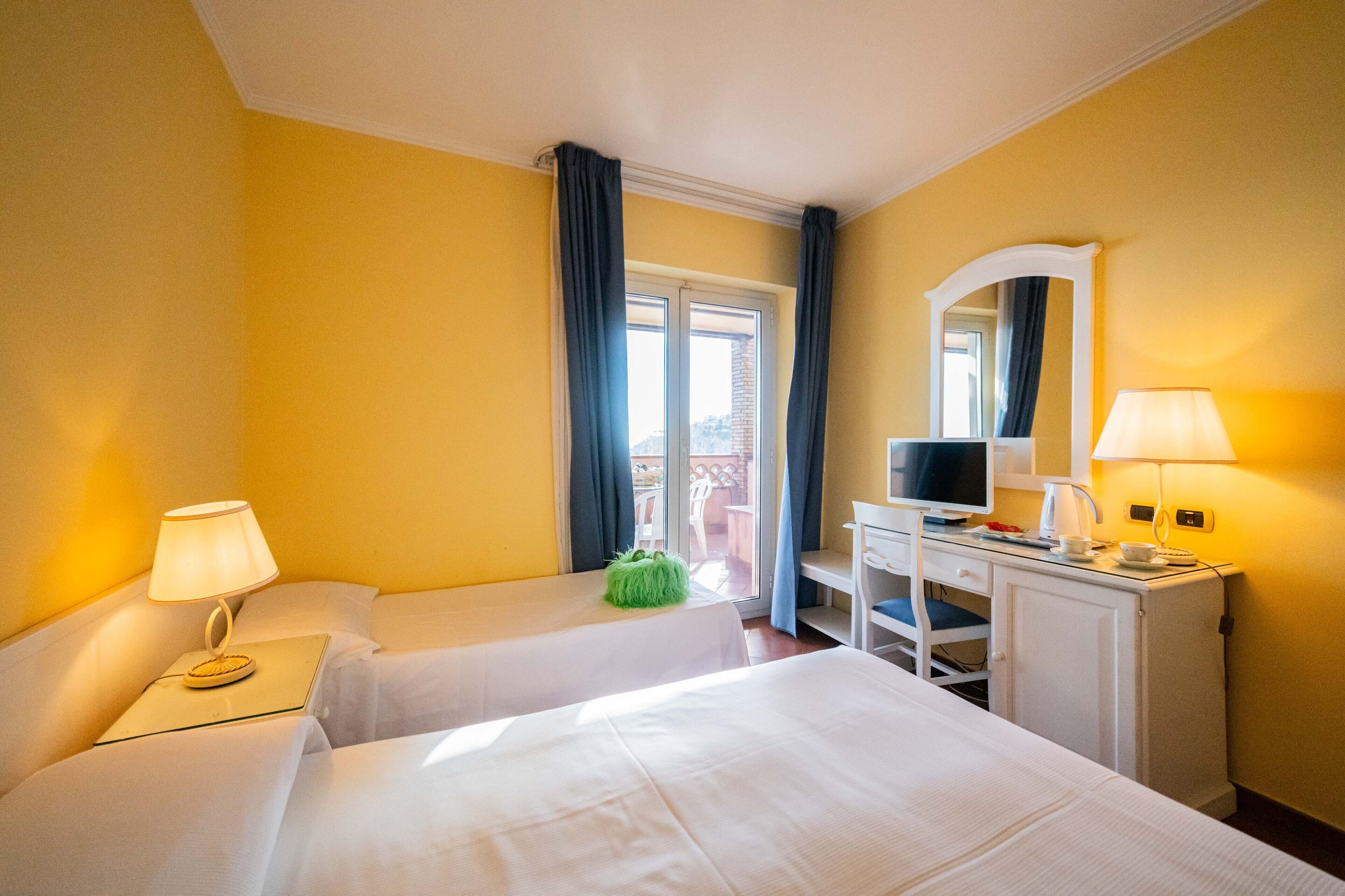 deluxe quadruple room, sea view | 1 bedroom, minibar, in-room safe, desk