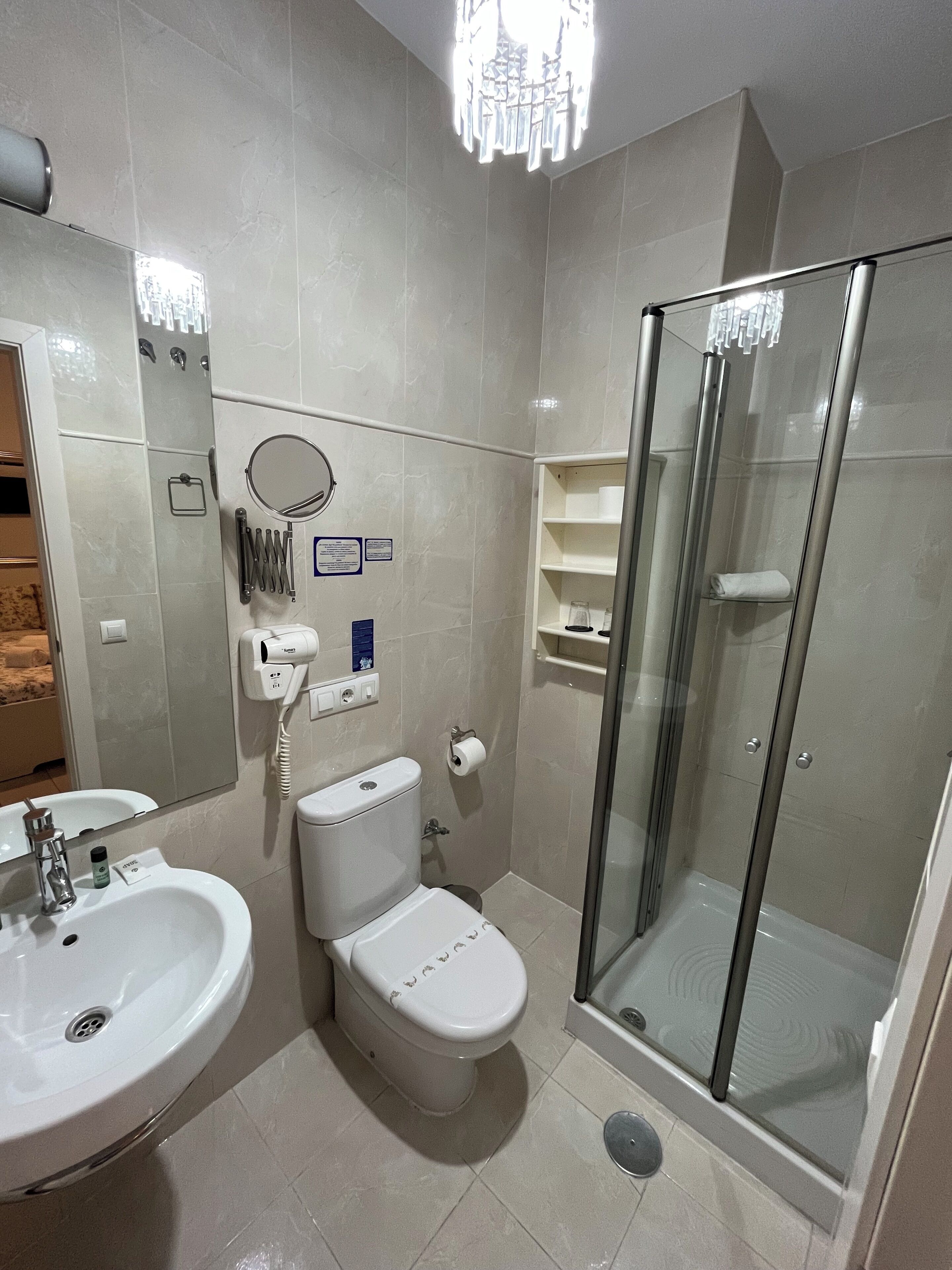 small economy room | bathroom | shower, free toiletries, hair dryer, towels