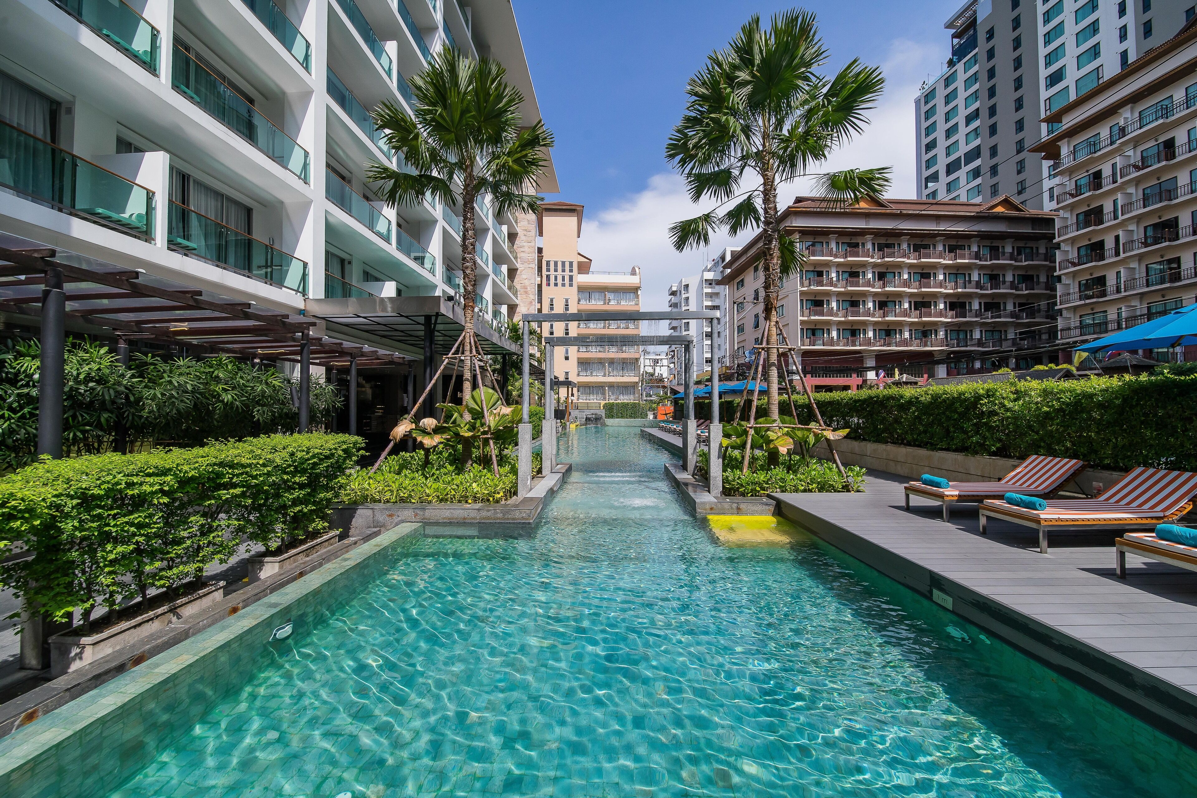 outdoor pool, pool umbrellas, pool loungers