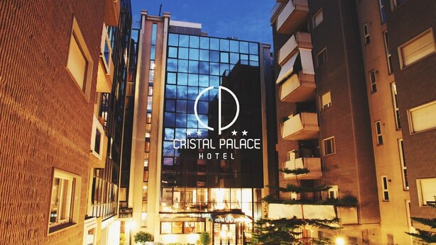 The exterior of Cristal Palace Hotel with a prominent glass facade and a logo featuring a stylized 'P'. - Cristal Palace Hotel (Andria)