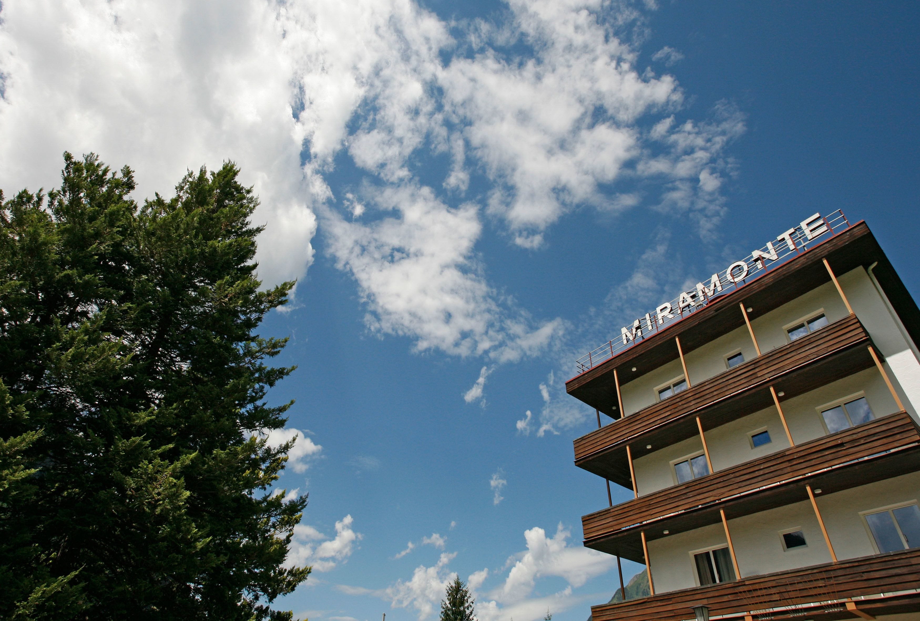 A multi-story building with the name "MIRMONTE" visible on the top.