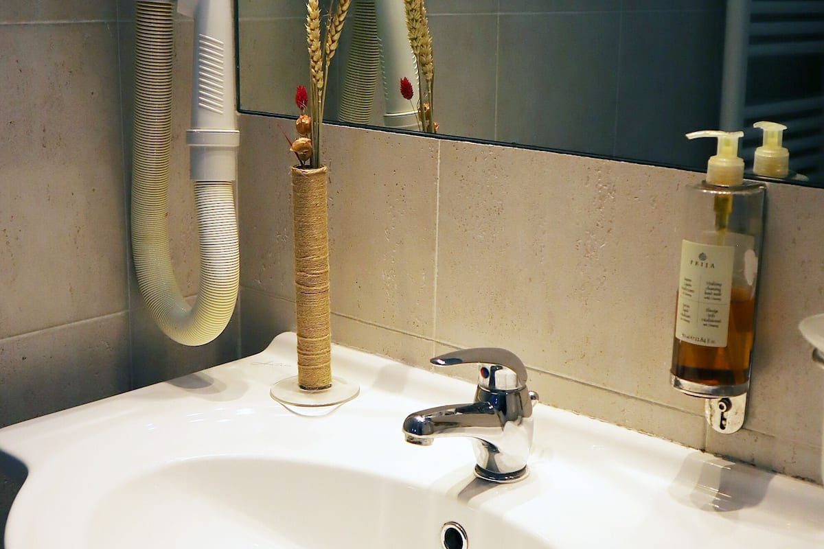 business double room, 1 queen bed | bathroom | hair dryer, towels, soap, toilet paper