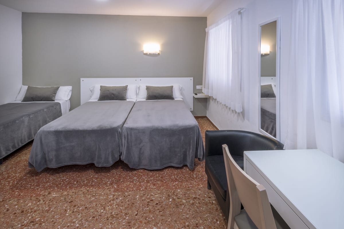 Standard Triple Room | Pillow-top beds, desk, blackout curtains, free WiFi