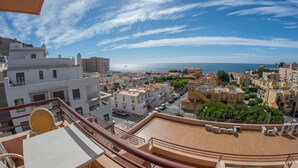 A coastal cityscape with buildings, a clear sky, and a view of the sea. - Aguadulce (Roquetas de Mar)