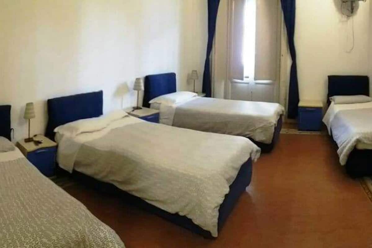 Quadruple Room, Private Bathroom | Premium bedding, desk, blackout drapes, iron/ironing board (on request)