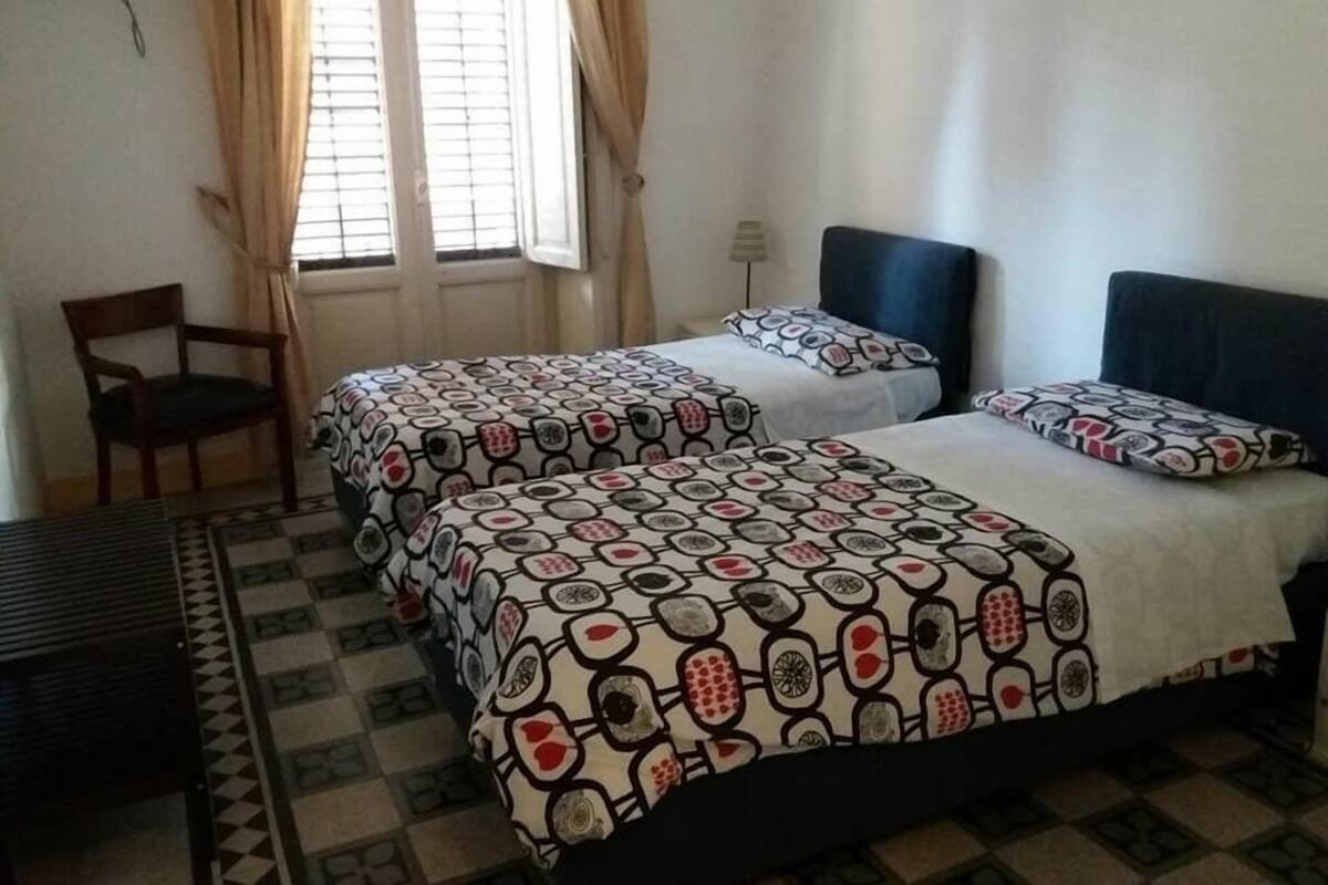 Premium bedding, desk, blackout drapes, iron/ironing board (on request)