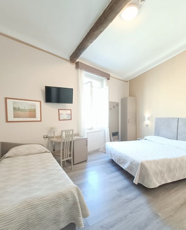 Triple Room | Down comforters, minibar, desk, blackout drapes