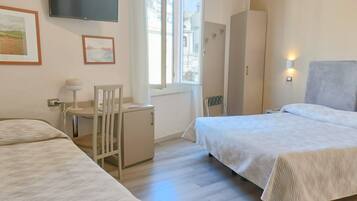 Triple Room | Down comforters, minibar, desk, blackout drapes