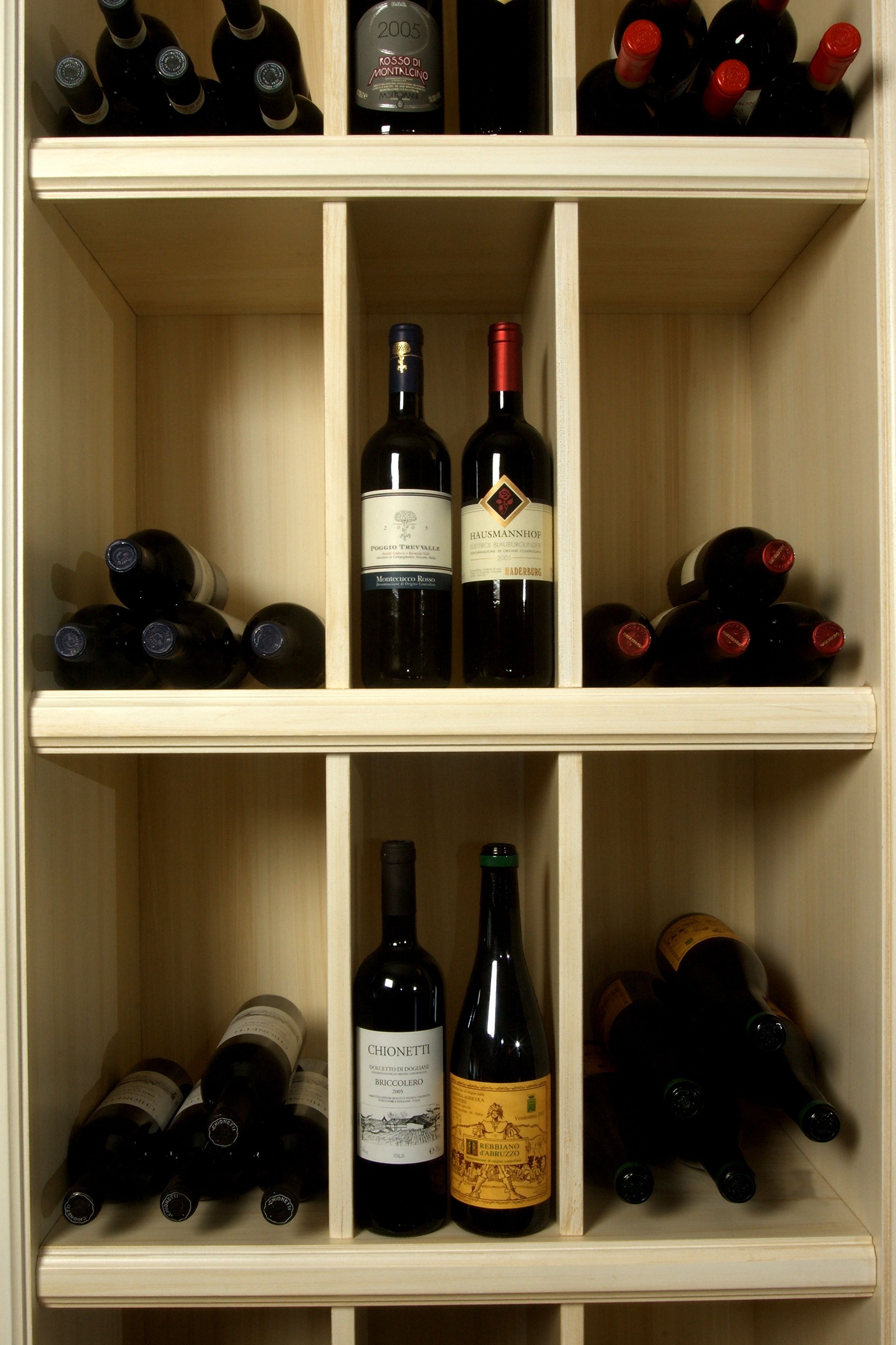 A wine rack with multiple bottles of wine.