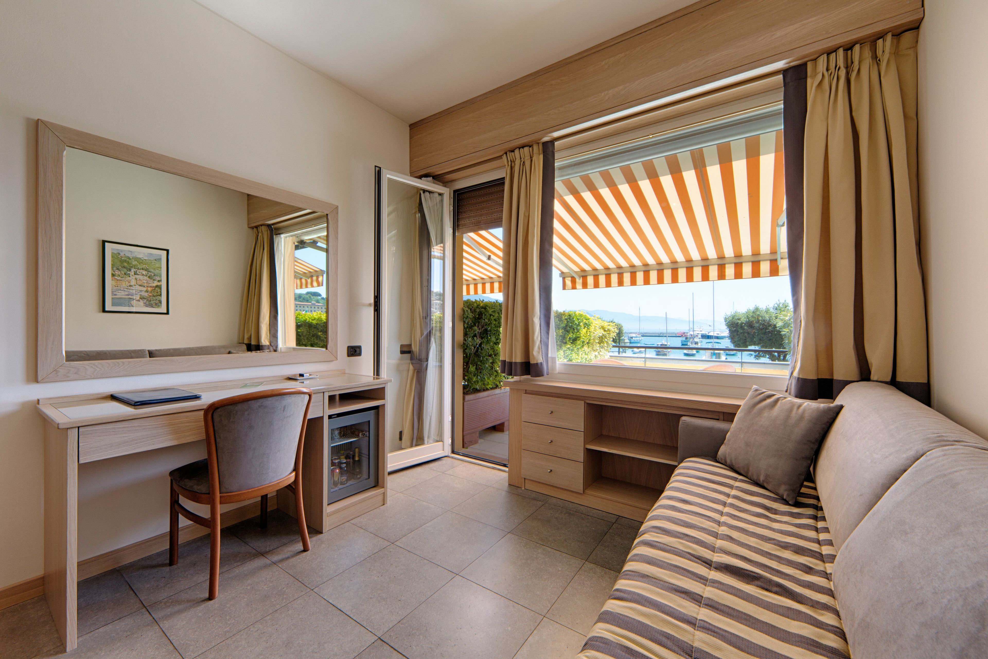 family room, terrace, sea view | down duvets, minibar, in-room safe, desk