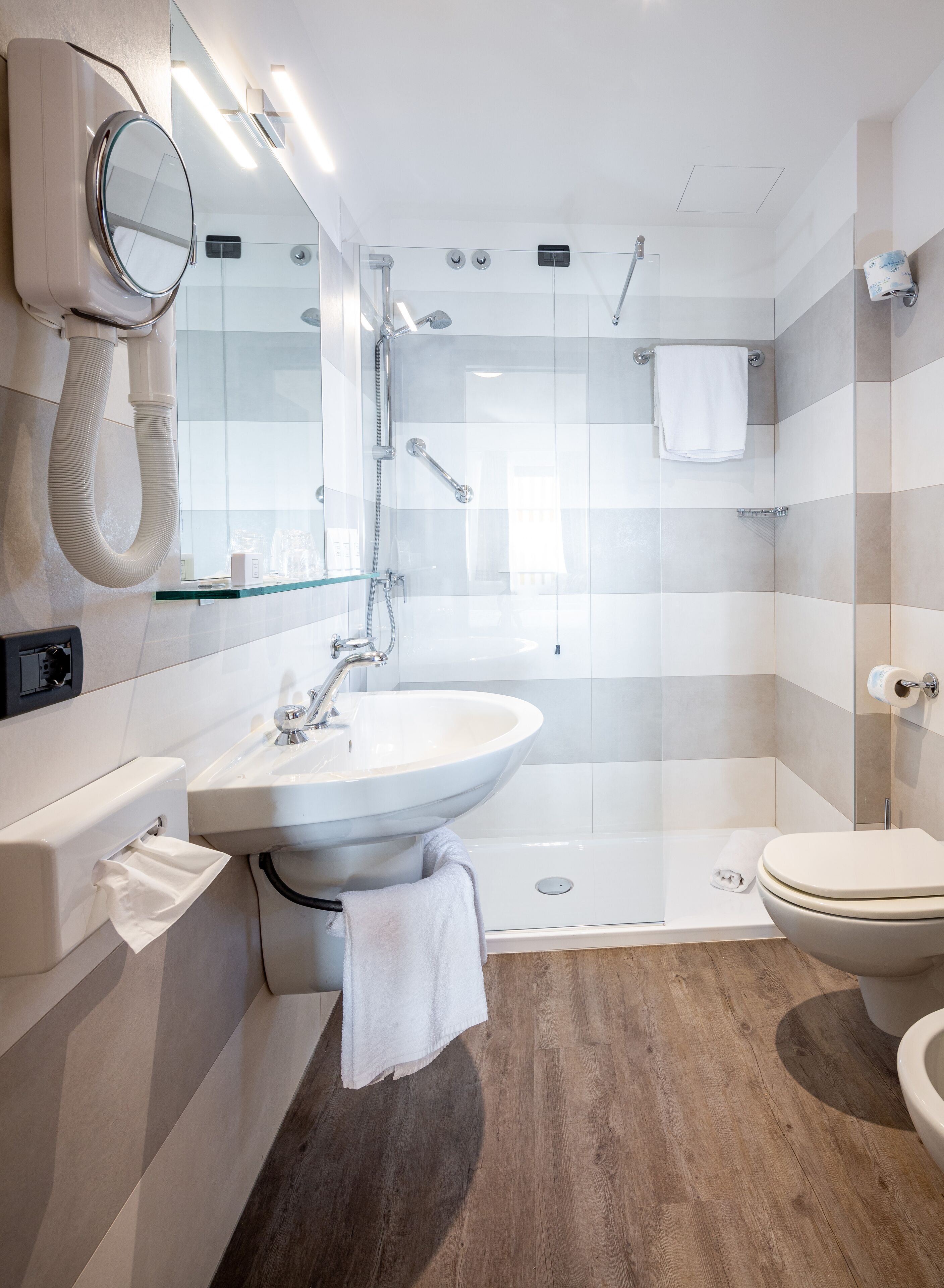 free toiletries, hair dryer, slippers, bidet