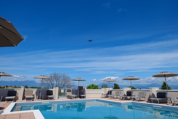 Outdoor pool, a rooftop pool, pool loungers