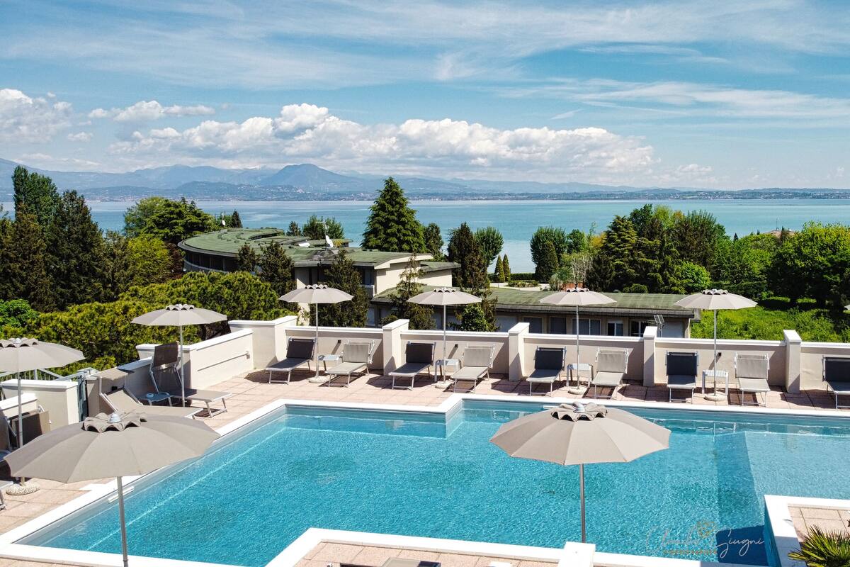 outdoor pool, a rooftop pool, pool loungers