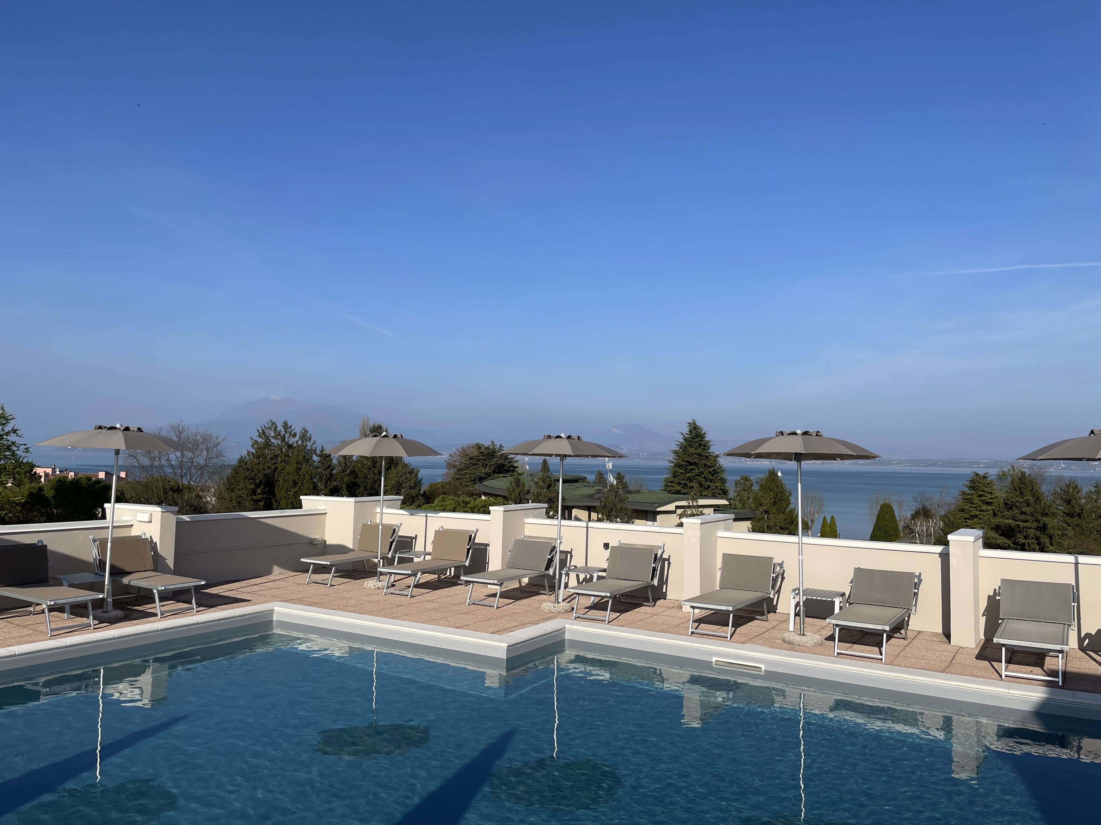 outdoor pool, a rooftop pool, pool loungers