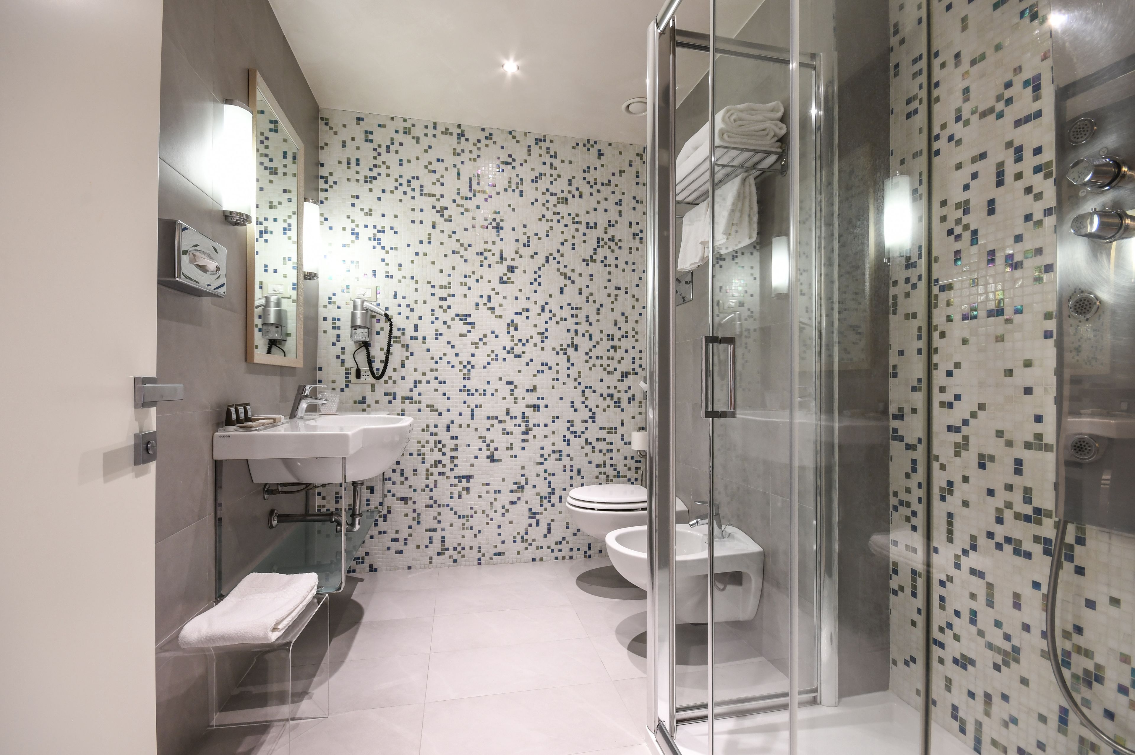 junior suite, balcony, partial lake view | bathroom | shower, free toiletries, hair dryer, slippers