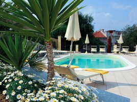 Outdoor pool, pool umbrellas, sun loungers