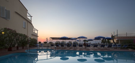 Seasonal outdoor pool, pool umbrellas, sun loungers