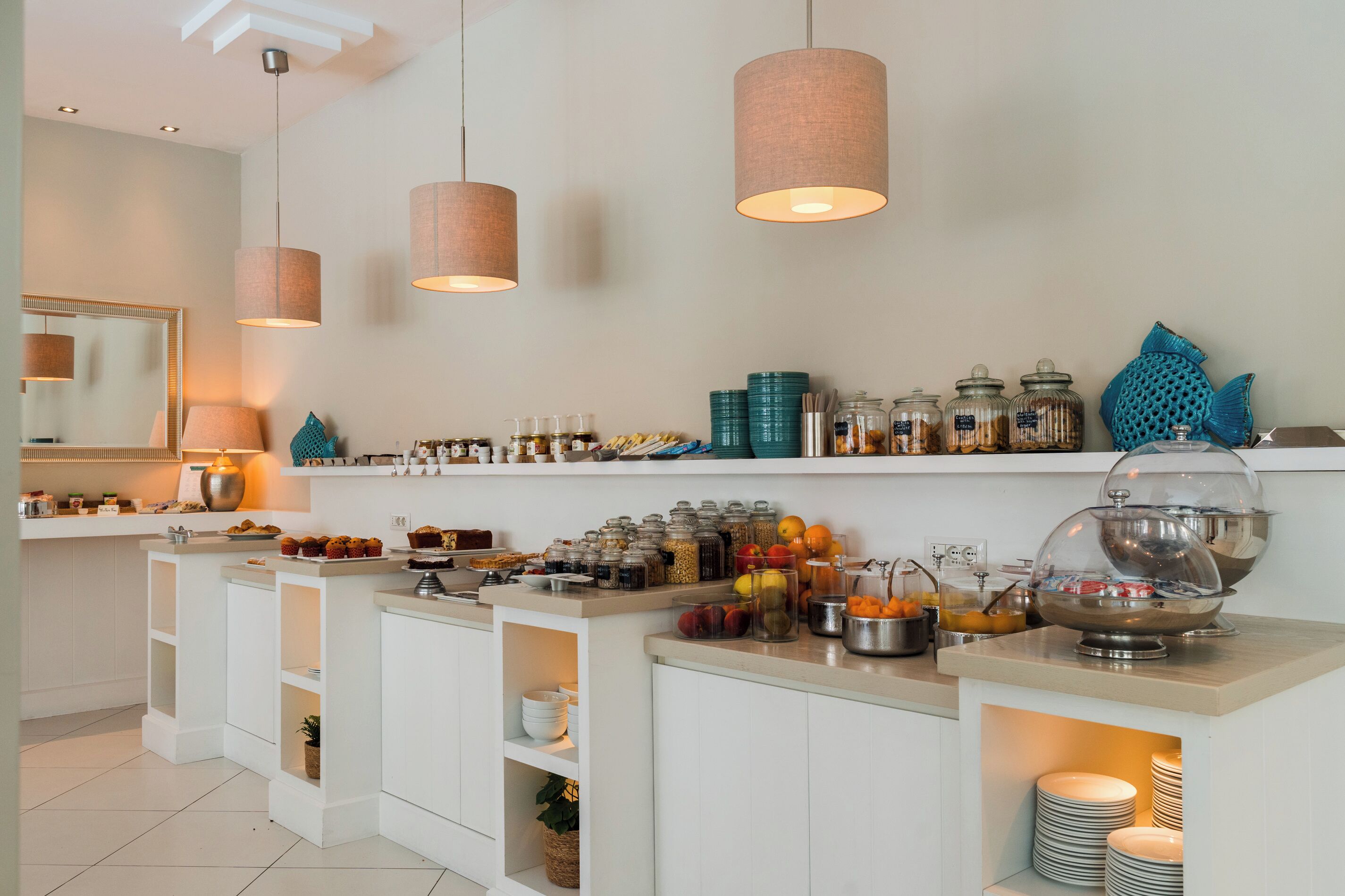 A breakfast bar with various food items and condiments.