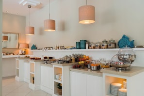 A breakfast bar with various food items and condiments. - Hotel Capri - Adult Only (Sorrento)