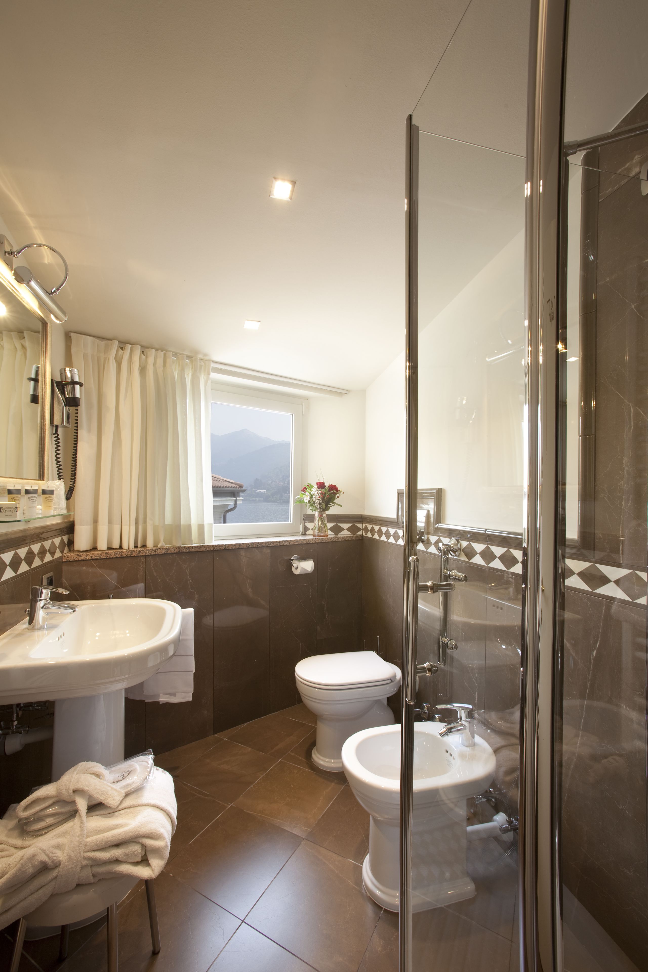 double room, lake view | bathroom | rainfall showerhead, free toiletries, hair dryer, bathrobes