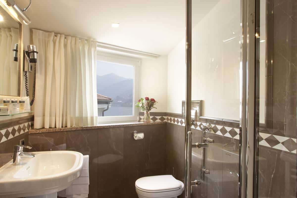double room, lake view | bathroom | rainfall showerhead, free toiletries, hair dryer, bathrobes