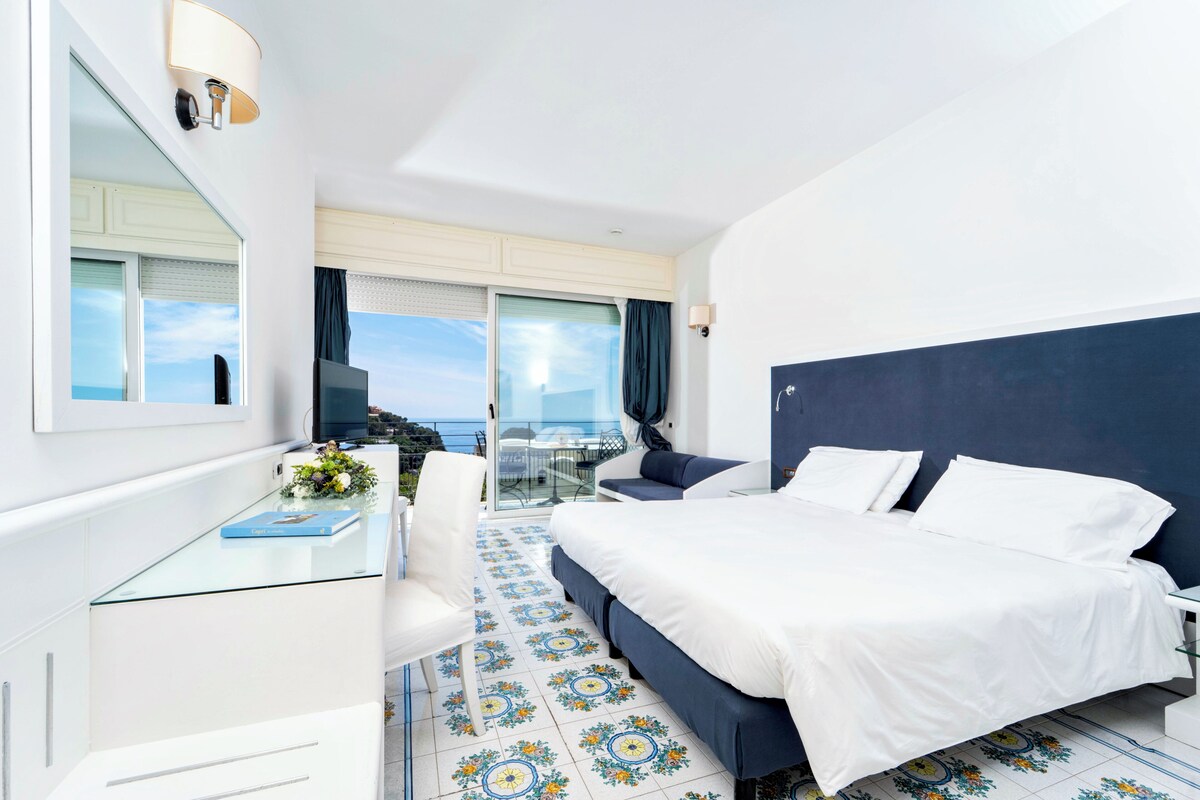 Superior Double or Twin Room, Sea View | Minibar, in-room safe, desk, laptop workspace