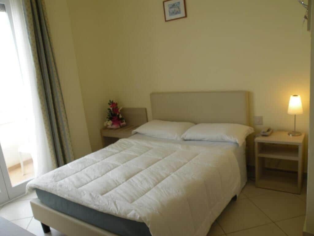 Panoramic Room, Sea View | Down comforters, minibar, in-room safe, desk