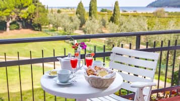 Classic Triple Room, Garden View | Balcony