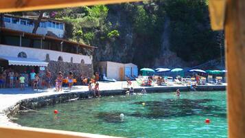 Private beach, sun loungers, beach umbrellas, beach bar