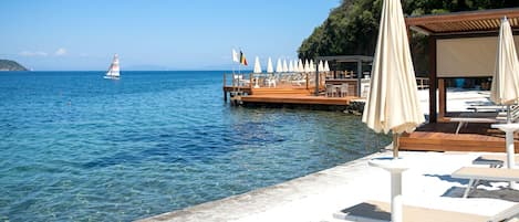 Private beach, sun loungers, beach umbrellas, beach bar