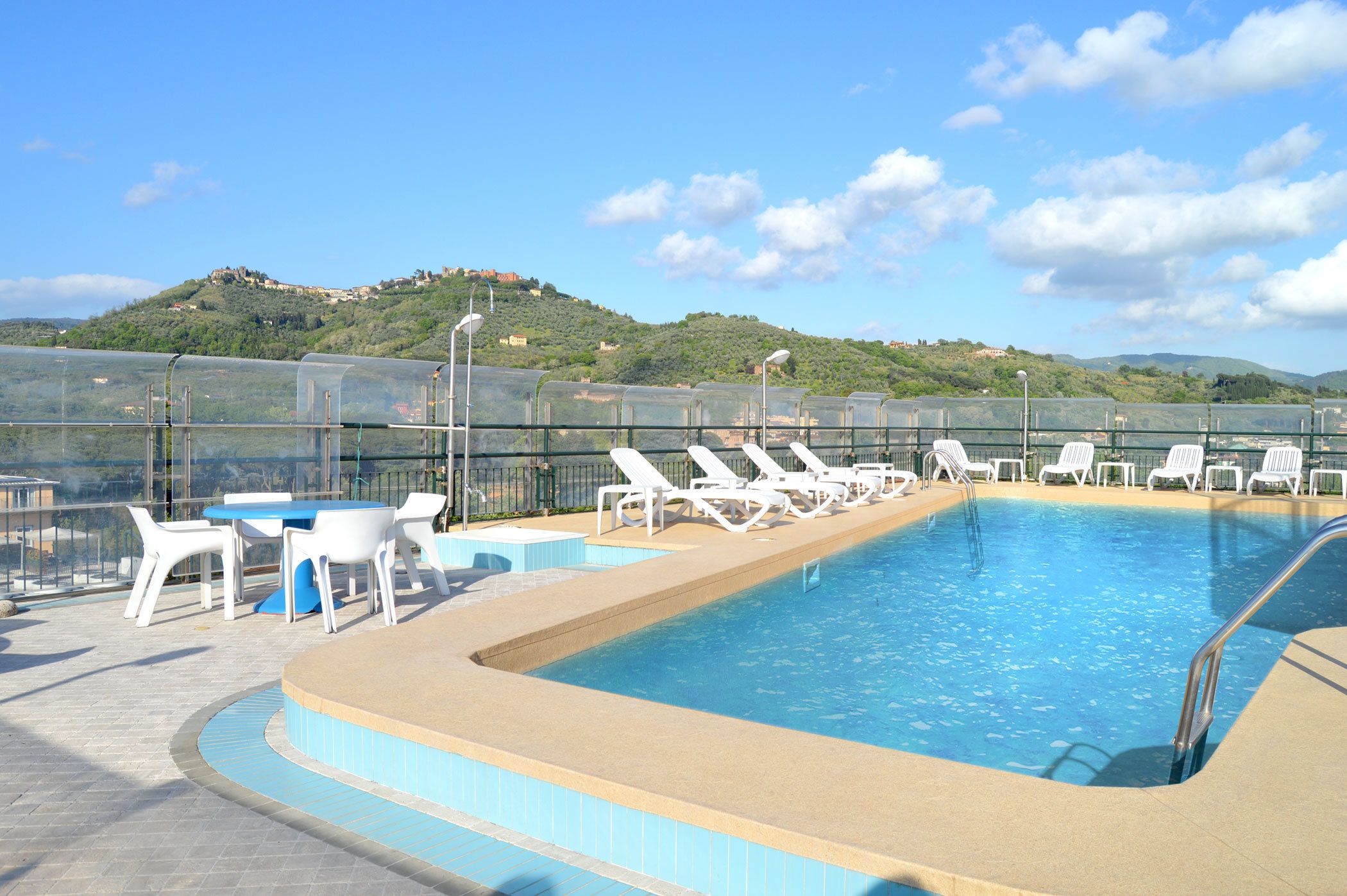 seasonal outdoor pool, pool umbrellas, pool loungers