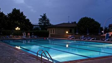 Outdoor pool, open 8:00 AM to 7:30 PM, pool umbrellas