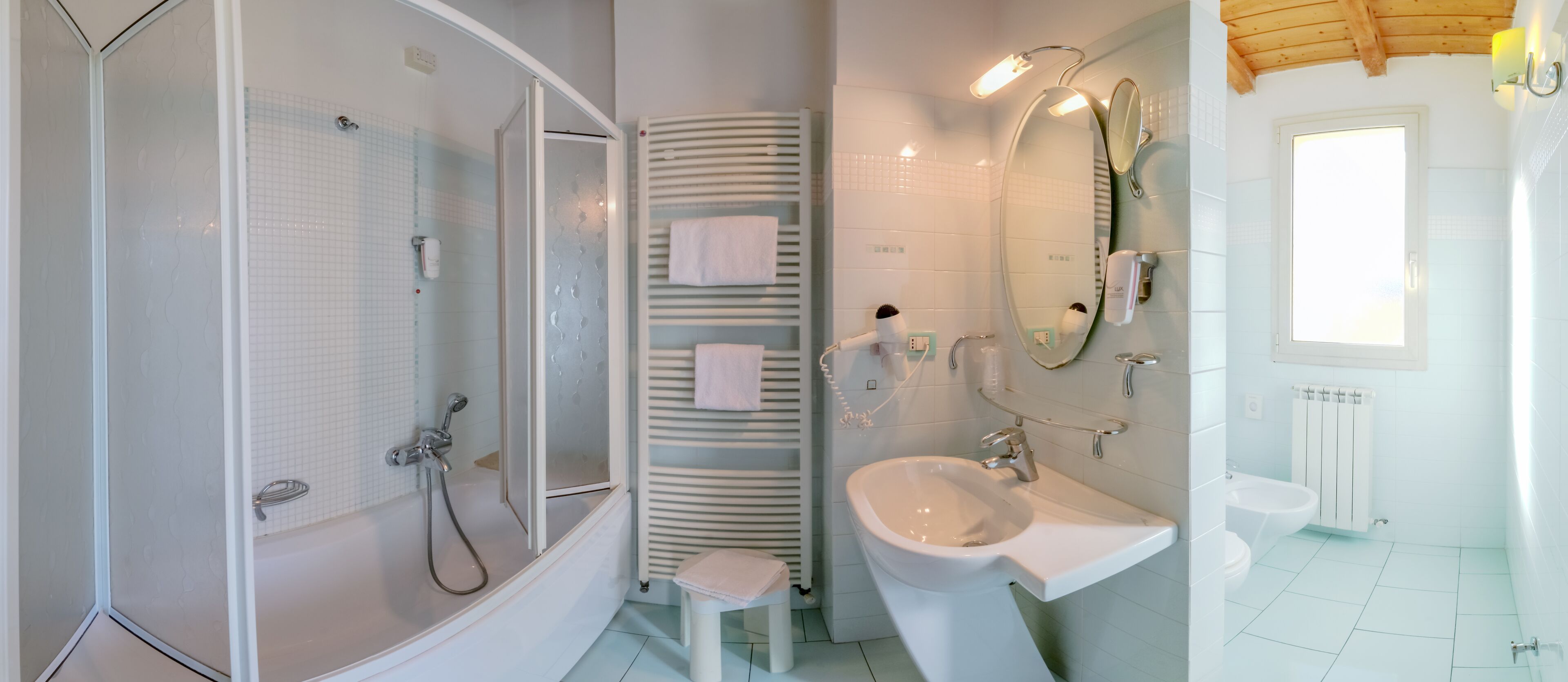 bathtub, hair dryer, bidet, towels