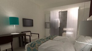 A hotel room with a bed, a desk, a chair, a TV, and a bathroom with a shower and toilet. - Hotel Sagittario (Padova)