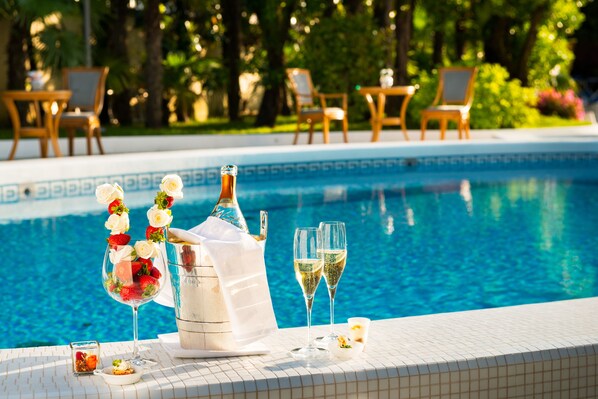 Indoor pool, 2 outdoor pools, open 8:00 AM to 8:00 PM, pool umbrellas