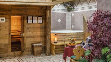 Cozy cabin with a wooden bench and candle-lit table, featuring a wooden door and wicker basket.