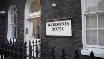 A brick building with a sign reading "WARDONIA HOTEL".