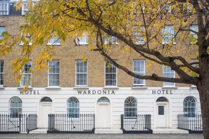 A building with the name 'WARDONIA' and 'HOTEL' signs, featuring a traditional brick facade, multiple windows, and a black iron fence. - Wardonia Hotel Kings Cross (London)