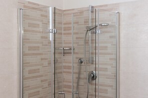 Economy Room, 1 Bedroom | Bathroom | Shower, rainfall showerhead, eco-friendly toiletries, hair dryer