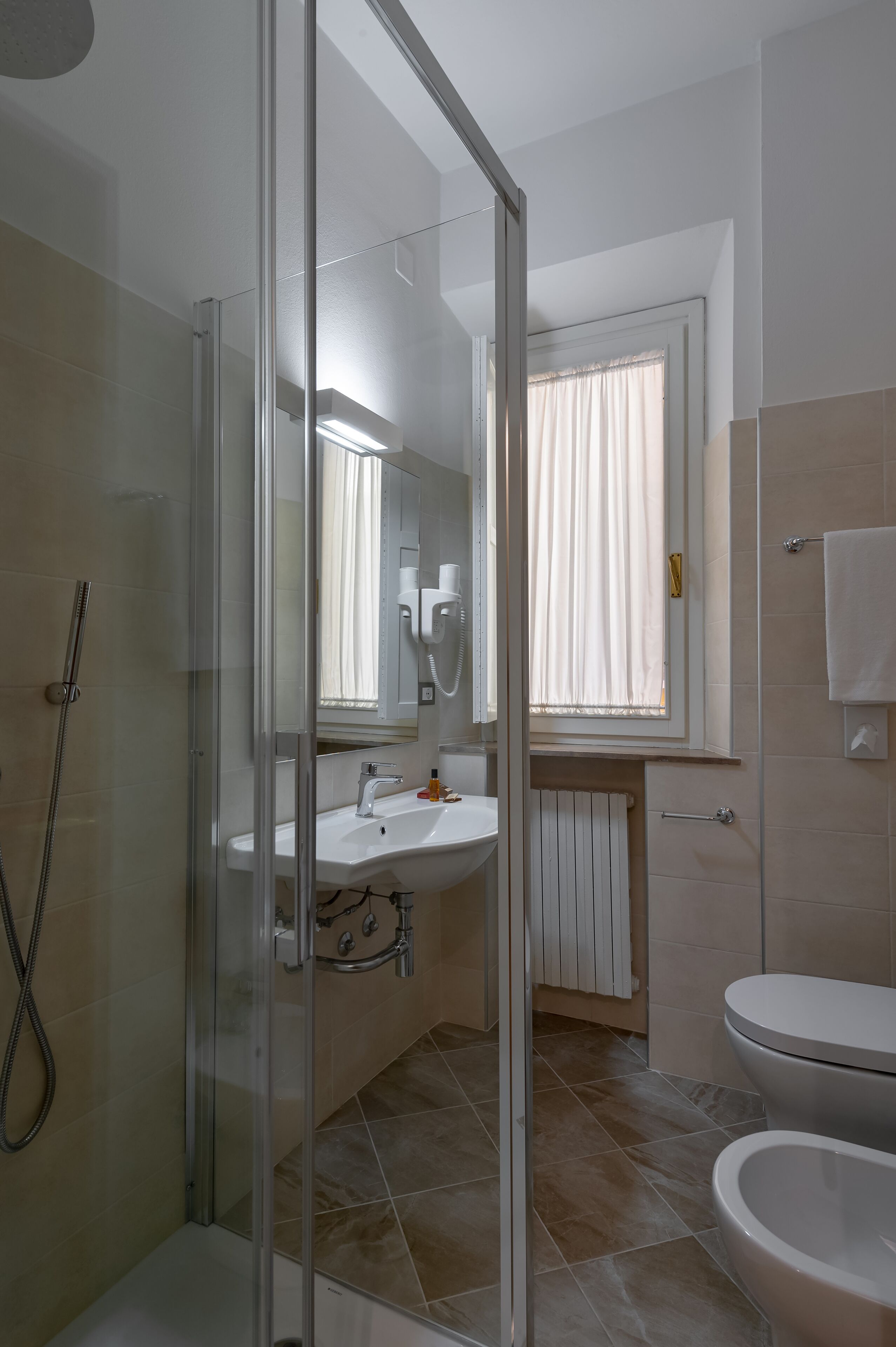 single room | bathroom | deep-soaking bathtub, rainfall showerhead, hair dryer, bidet
