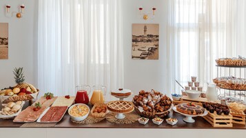 Desayuno buffet diario (EUR 12 por persona)