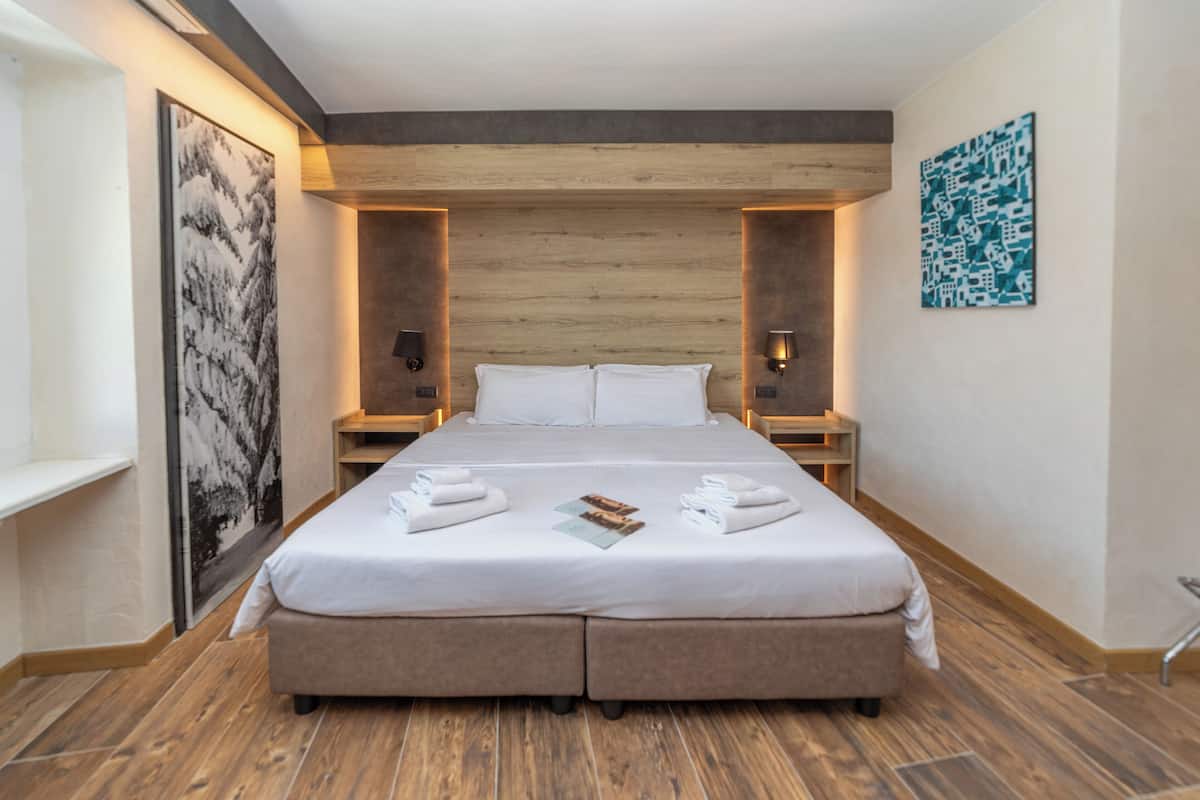 Down duvets, pillow-top beds, minibar, in-room safe