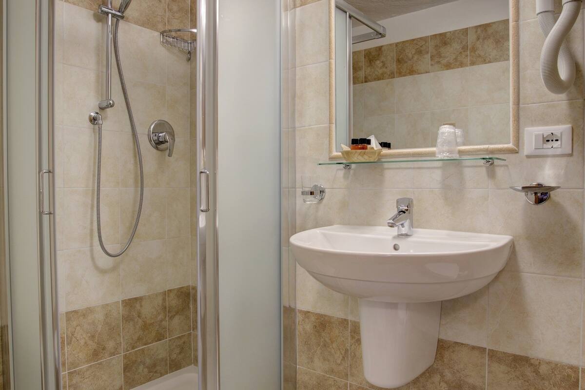double room | bathroom | shower, rainfall showerhead, hair dryer, bidet