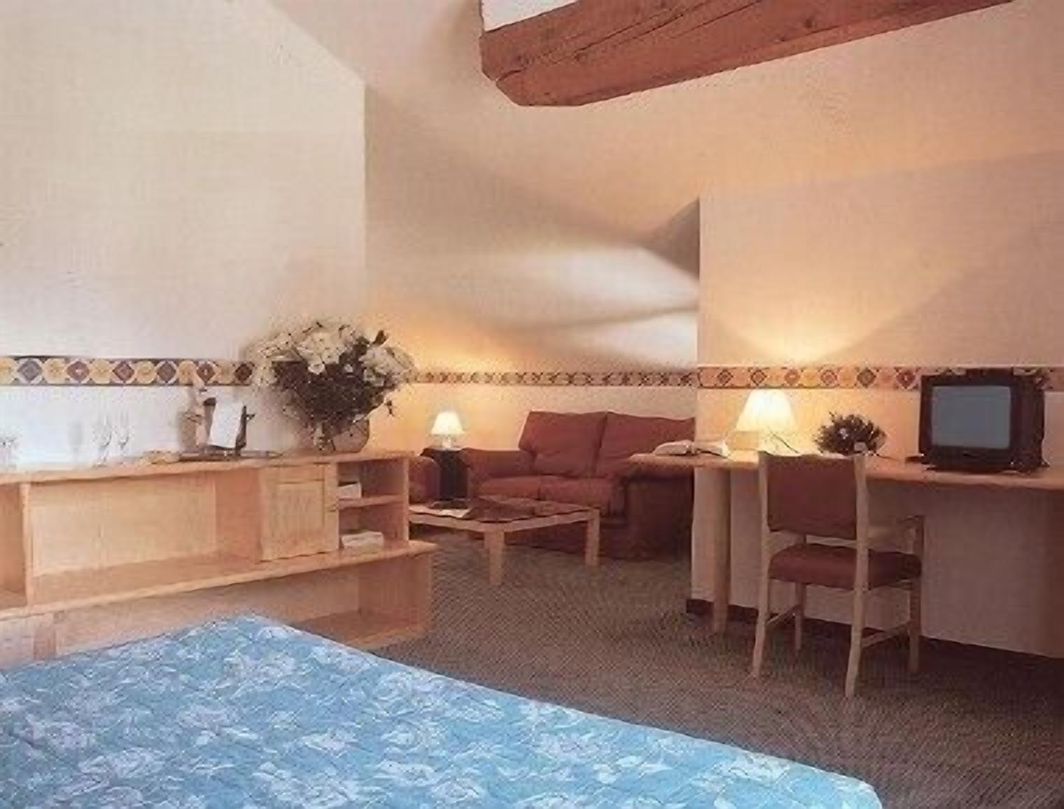 superior quadruple room | living area | tv