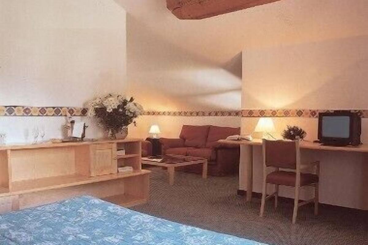 superior quadruple room | living area | tv