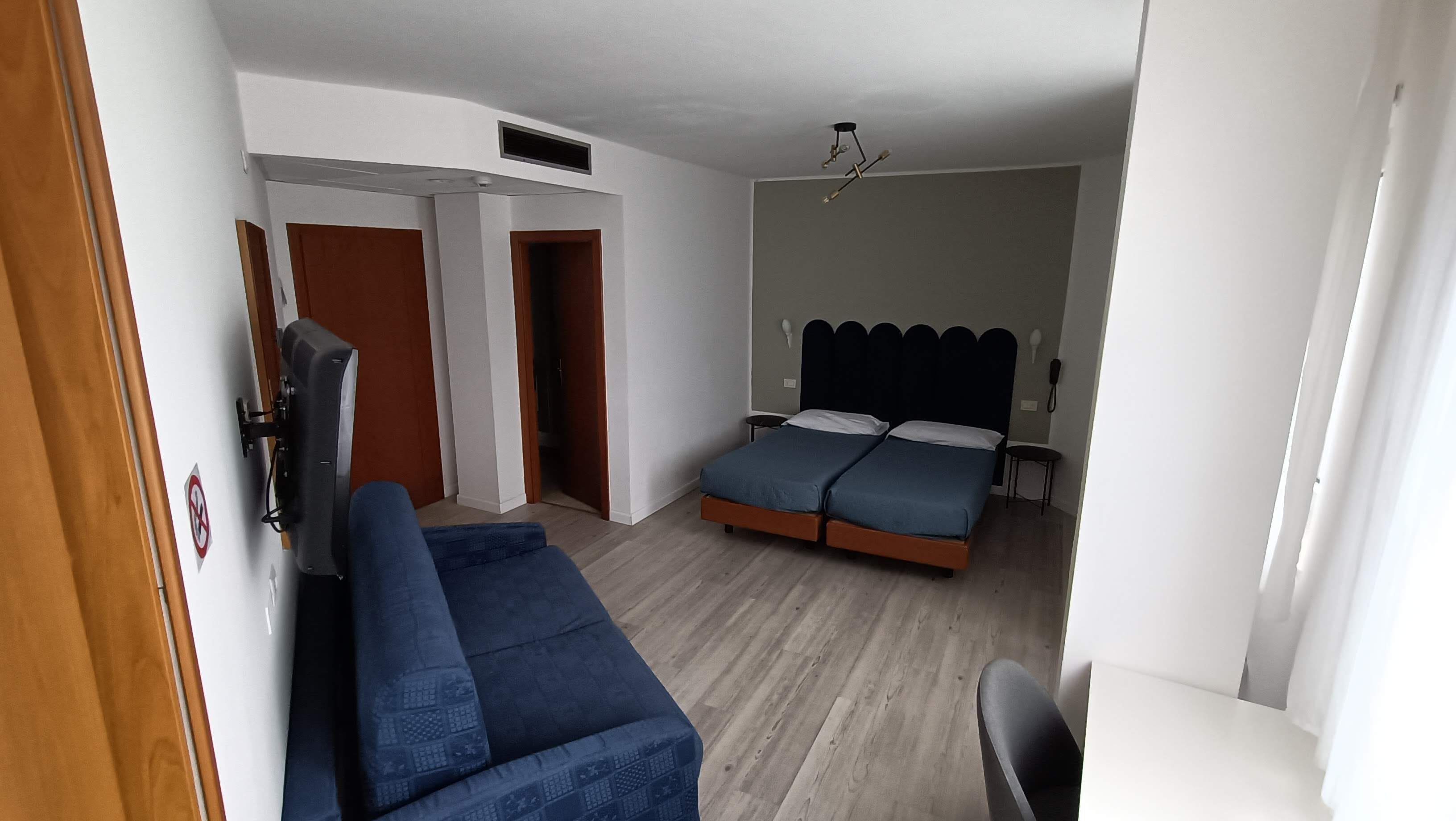 Economy Quadruple Room, Multiple Beds | Minibar, in-room safe, desk, free WiFi