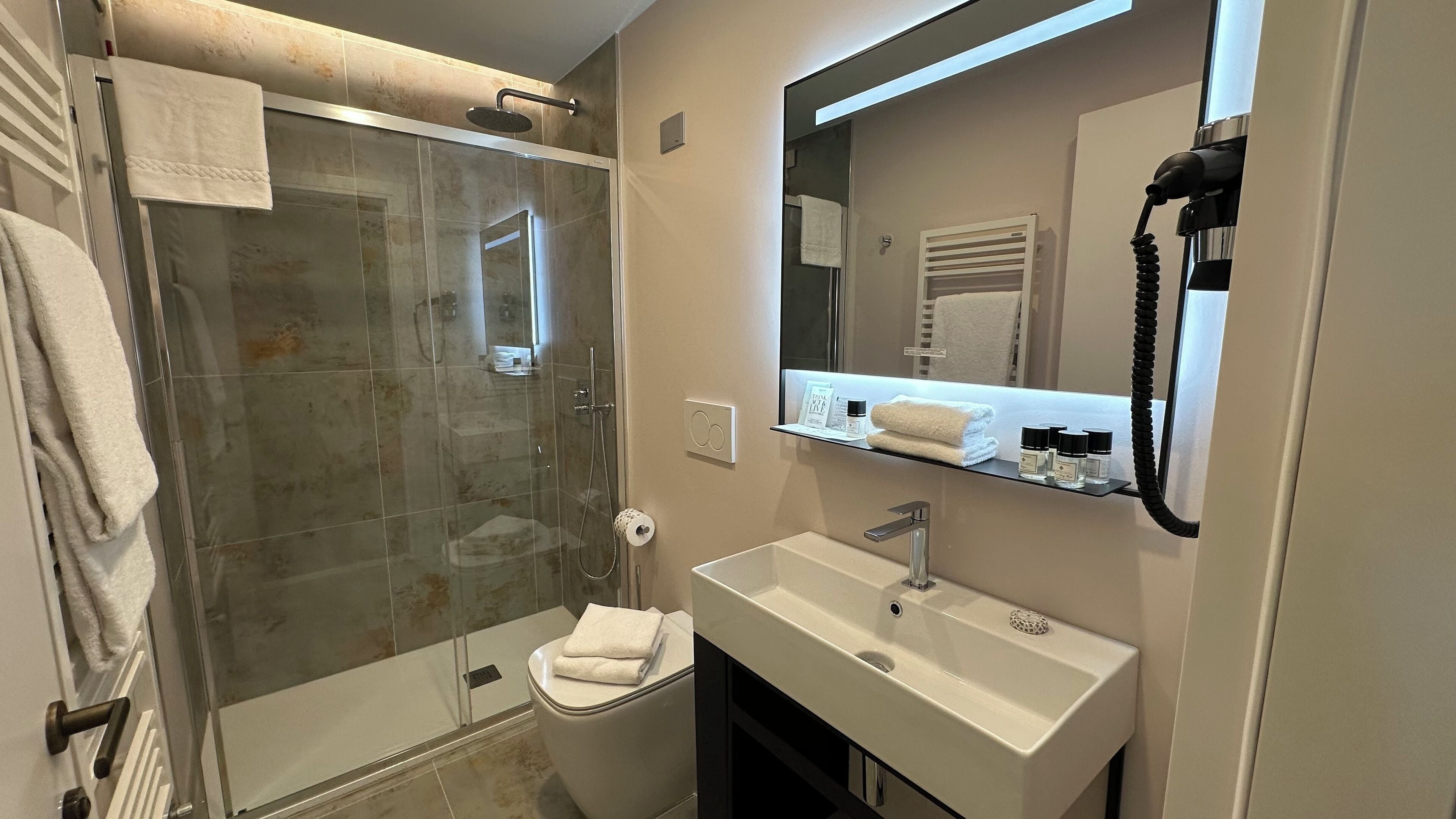deluxe double or twin room | bathroom | eco-friendly toiletries, hair dryer, towels