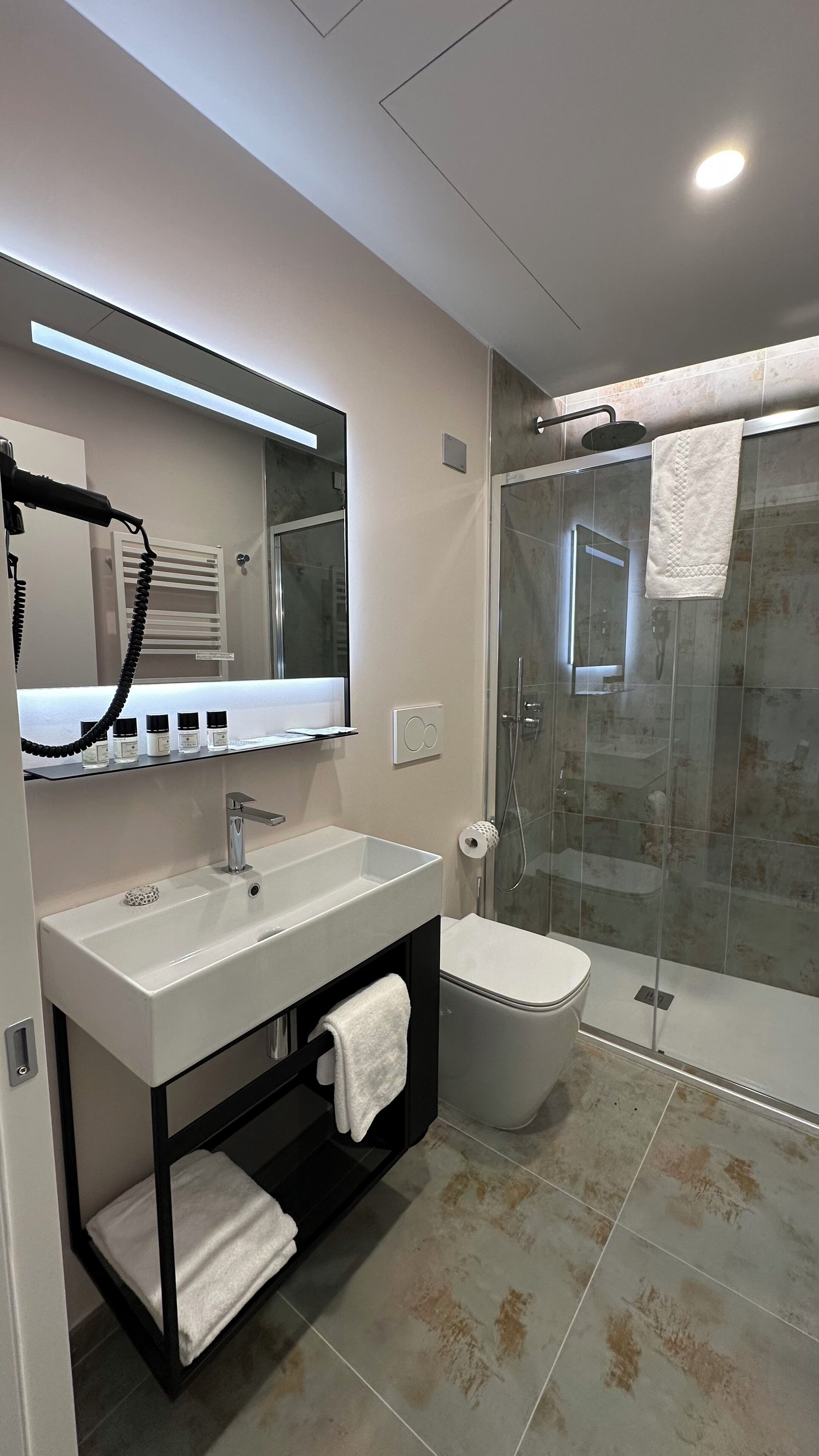 deluxe double or twin room | bathroom | eco-friendly toiletries, hair dryer, towels