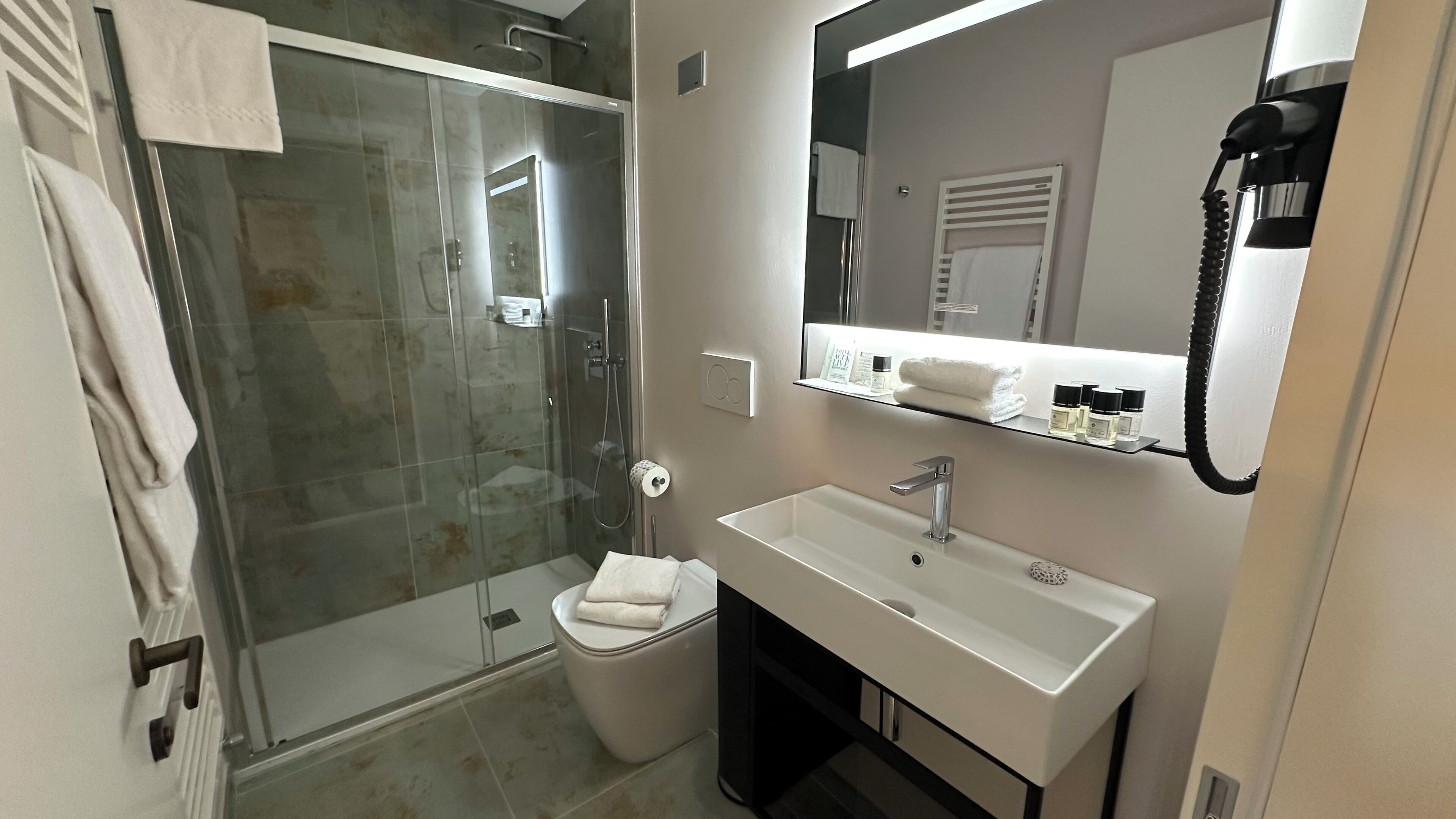 deluxe double or twin room | bathroom | eco-friendly toiletries, hair dryer, towels