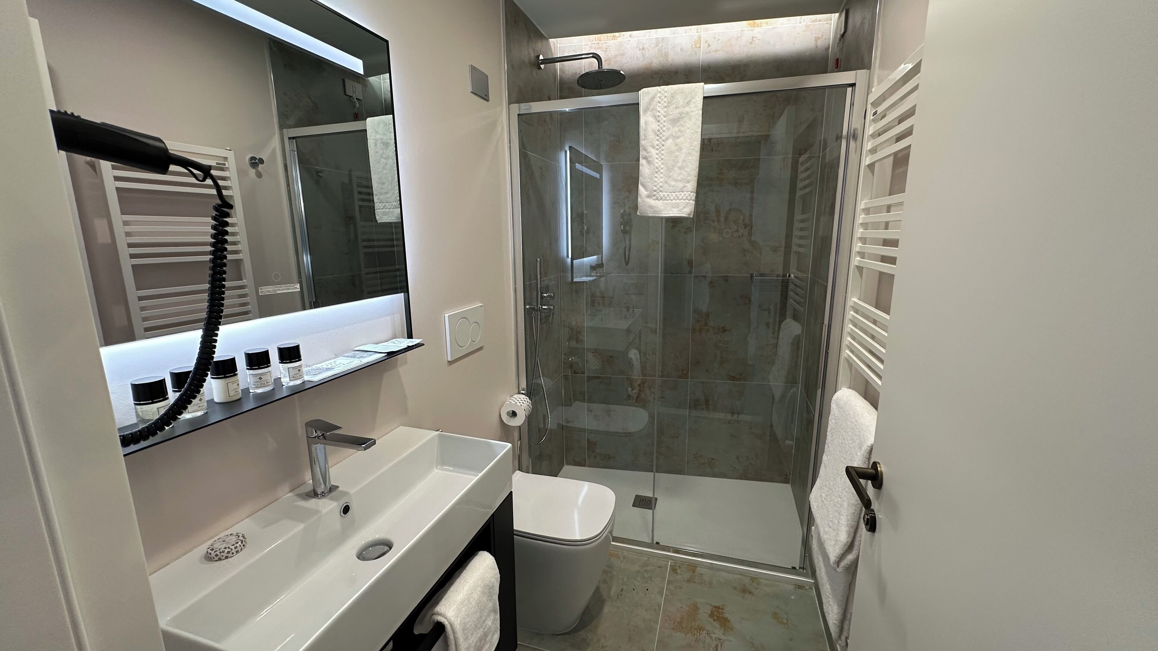 deluxe double or twin room | bathroom | eco-friendly toiletries, hair dryer, towels